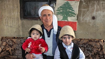 Akiki and members of his family. He hopes to keep the hat-making tradition alive by teaching his nephews