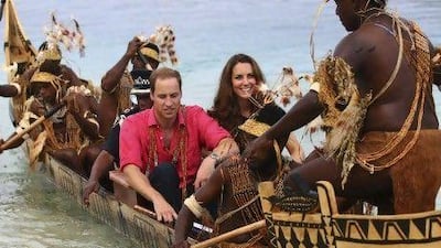 The Duke and Duchess of Cambridge on an official visit to the Solomon Islands yesterday. The royal family has launched an unprecedented legal battle in France over the publication of topless photographs of the Duchess.