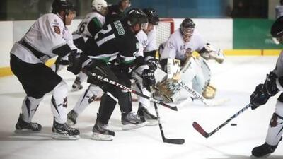 Al Ain Vipers, in black, defeated Dubai Mighty Camels 5-3 at Zayed Sports City last night in the Emirates Hockey League (EHL). KC Finnegan and Janne Lehtosalo were among the scorers for Al Ain. Fatima Al Marzooqi/ The National