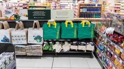 A ban on single-use shopping bags in Abu Dhabi and a charge for them in Dubai will see supermarkets focus on reusable bags. Antonie Robertson / The National