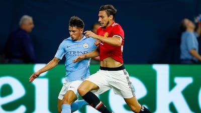 Manchester United defender Matteo Darmian, right, wants to stay put at Old Trafford. Aaron M Sprecher / AFP