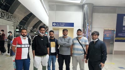 A group of passengers including Harjinder Singh, left, and Deepak Gupta, right, have been stranded at Dubai airport since March 18 due to coronavirus restrictions. Courtesy: Deepak Gupta
