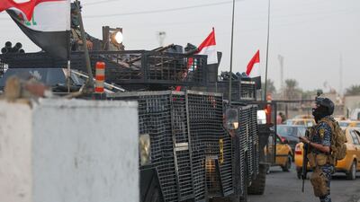 Iraqi police are seen deployed in Baghdad's predominantly Shiite Sadr City. Demonstrations across Baghdad and the south have spiralled into violence over the last week, with witnesses reporting security forces using water cannons, tear gas and live rounds and authorities saying "unidentified snipers" have shot at protesters and police. On Sunday evening a mass protest in Sadr City in east Baghdad led to clashes that medics and security forces said left 13 people dead. AFP