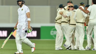 South Africa captain Faf du Plessis walks off the pitch after his dismissal by Mitchell Starc in Day 3. Peter Parks / AFP