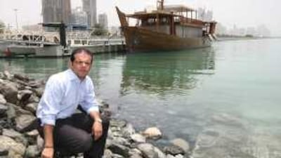 Rabih Bobo at the spot at the end of the Corniche in Al Mina port where he dived into the sea to save a man trapped in his car.
