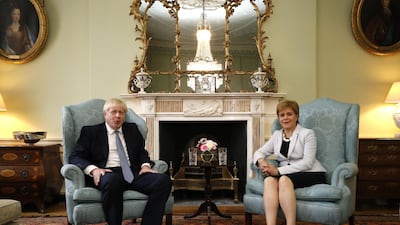 Britain's Prime Minister Boris Johnson and Scotland's First Minister Nicola Sturgeon pose for a photograph before talks at Bute House in Edinburgh. AFP