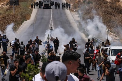 Israeli police fire tear gas at Palestinian protesting against illegal settlements in occupied West Bank. AFP