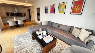 The living room and dining area of the corner apartment