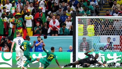 England's Jordan Henderson, left, scores their first goal. PA
