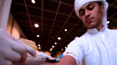 A student at one of the Higher Colleges of Technology has his blood tested for the genetic disease thalassaemia.