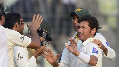 Yasir Shah, right, claimed a seven wicket haul to lead Pakistan to victory over Bangladesh. Munir uz Zaman / AFP