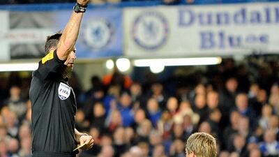 Chelsea's Fernando Torres is sent off by referee Mark Clattenburg during the English Premier League match against Manchester United. Gerry Penny / EPA