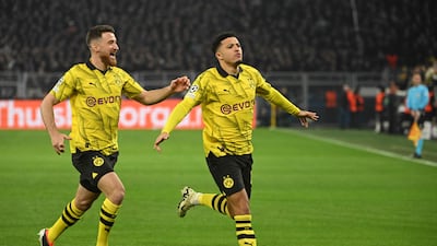 Jadon Sancho celebrates with Salih Ozcan after scoring Borussia Dortmund's opening goal in the Uefa Champions League last 16, second leg against PSV Eindhoven at the Signal Iduna stadium in Dortmund, Germany on March 13, 2024. AFP