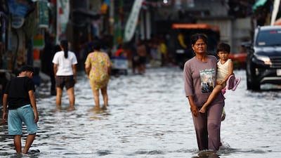 Flooding caused by rising sea levels and land subsidence in North Jakarta, Indonesia. Researchers have warned that climate change targets may be out of reach as temperatures continue to rise. Reuters