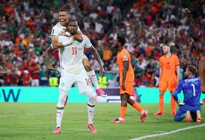Morocco's Issa Diop celebrates scoring their equaliser. Reuters