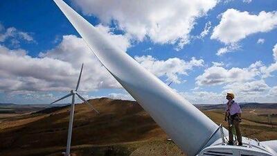 Sturt Daley, site manager, stands atop a wind turbine nacelle at Capital Wind Farm in Bungendore, Australia. Ian Waldie / Bloomberg News