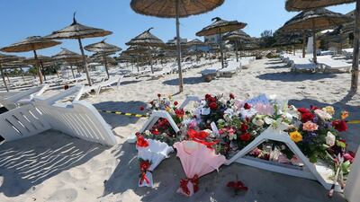 Flowers lie in tribute to those killed in a terror attack on tourists on a beach in front of the Imperial Marhaba Hotel in Al Sousse on Sunday. Mohamed Messara / EPA