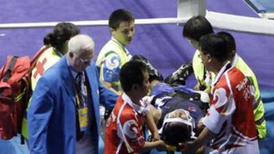 The Samoan boxer Farani Tavui is carried from the ring on a stretcher.