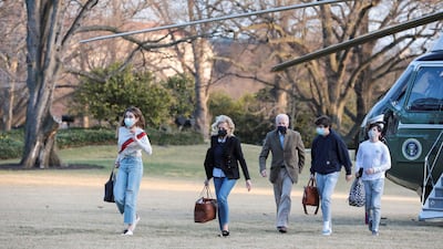 US President Joe Biden walks with first lady Jill Biden, their grandchildren Natalie and Hunter, and a family friend near the White House in Washington. Reuters