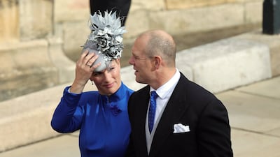 Zara Tindall, wearing a royal blue dress and a light blue headpiece, and Mike Tindall arrive ahead of the wedding of Princess Eugenie of York and Jack Brooksbank at St George's Chapel, Windsor on October 12, 2018. Getty Images