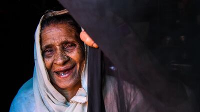 Rohingya refugee, Gulzar, 60, gestures as she stands at the entrance of her tent in Kutupalong refugee camp in Ukhia near Cox's Bazar. Chandan Khanna/AFP