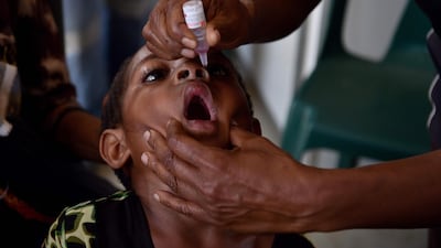 A child receives a polio vaccination in the Western Highlands of Papua New Guinea. AFP