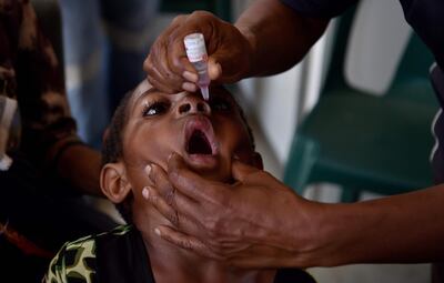 A child receives a polio vaccination in the Western Highlands of Papua New Guinea. AFP
