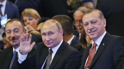 Russian President Vladimir Putin and Turkey's President Recep Tayyip Erdogan attend a session of the World Energy Congress, in Istanbul, Monday, Oct. 10, 2016. (AP Photo/Emrah Gurel)