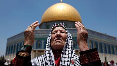 A Palestinian Muslim worshipper attends the first Friday prayers of Ramadan in front of the Dome of the Rock at Jerusalem’s Al Aqsa mosque compound. AFP