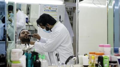 Zulzar Ahmed, a barber in Baniyas East, says the municipality training programmes are helpful. Christopher Pike / The National