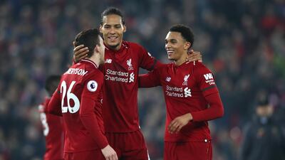 Andy Robertson, left, and Trent Alexander-Arnold, right, with Virgil van Dijk, centre, have helped Liverpool's attacking threat. Getty