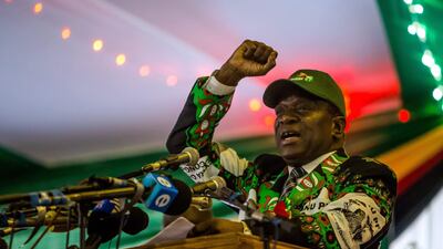 Zimbabwe's President Emmerson Mnangagwa delivers a speech after he was endorsed as ZANU-PF party president and nominated presidential candidate for the 2018 elections during the ZANU-PF party extraordinary congress in Harare, on December 15, 2017. / AFP PHOTO / Jekesai NJIKIZANA