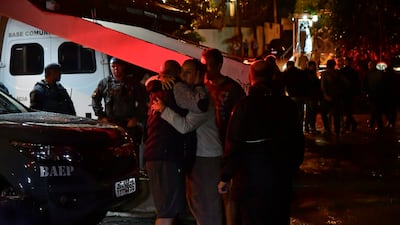 Luiz Augusto de Oliveira, left, the owner of the house the plane crashed into. Getty Images