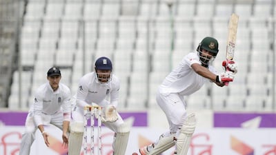 Tamim Iqbal's century for Bangladesh was countered by Moeen Ali's five wicket haul for England. AM Ahad / AP Photo