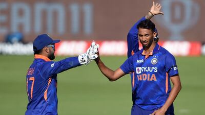 Fast bowler Prasidh Krishna, right, dismissed West Indies' Jason Holder. AFP