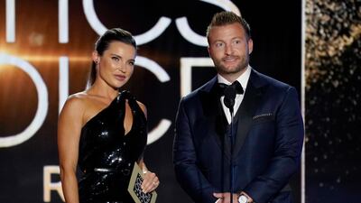 Veronika Khomyn, left, and Sean McVay present the award for Best Picture. AP