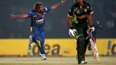 Lasith Malinga celebrates after taking the final wicket of Pakistani cricketer Bilawal Bhatti during the opening match of the Asia Cup one-day cricket tournament at the Khan Shaheb Osman Ali Stadium in Fatullah, on the outskirts of Dhaka on February 25, 2014. Dibyangshu Sarkar / AFP