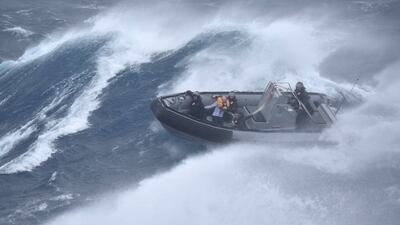 The rescue of a sailor from a catamaran near New Zealand's North Island city of Whangarei. AFP