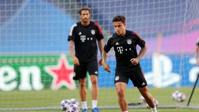 Philippe Coutinho warms up during the training session. Getty