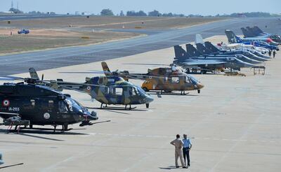 Helicopters and fighter jets at the Aero India. AFP