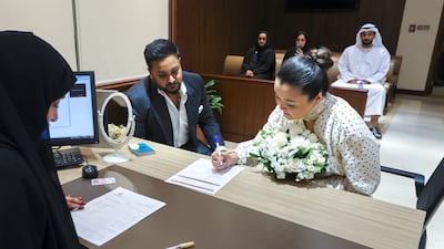 Pebin Muriyamadom, from Switzerland, and Sabina Doskaliyeva, from Kazakhstan, decided to fast-track their wedding
