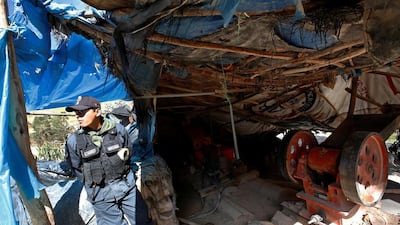 A police officer at an illegal gold mining camp in Salpo. Mariana Bazo / Reuters
