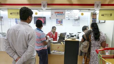 The dirham is pegged to the US dollar so any depreciation against the dollar allows non-resident Indians to buy more rupees per dirham. Pawan Singh / The National