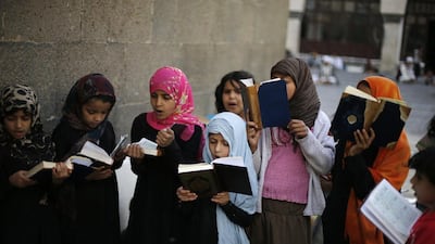 Girls recite the Quran at the Grand Mosque in Sanaa on the first day of the fasting month. Khaled Abdullah/Reuters