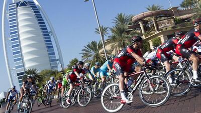 The peloton rolls through in front of the Burj Al Arab earlier this year during the 2015 Dubai Tour. Claudio Peri / EPA / February 7, 2015