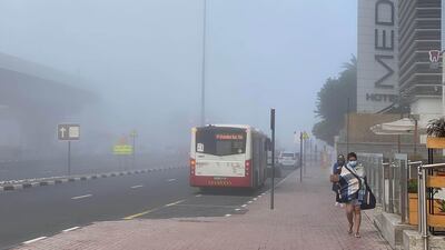 Buses amid the fog in Media City, Dubai. Leslie Pableo for The Natioal