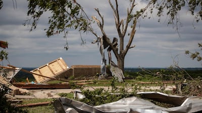 Metal parts of roof are tangled in a tree after a tornado near the storm shelter at the Barn on a wedding venue, May 4, Texas, US. AP
