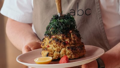 A full cauliflower roasted and served to share is one of the star dishes at abc kitchens. Photo: abc kitchens