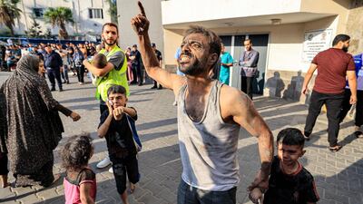 Palestinians outside Al-Shifa hospital in Gaza City on the sixth day of fighting between Israel and Hamas. AFP