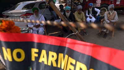 Farmers have continued to protest despite the pledge to repeal the laws. AFP